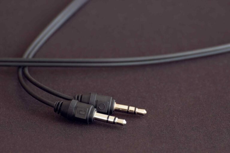 Two headphone plugs needing a splitter.