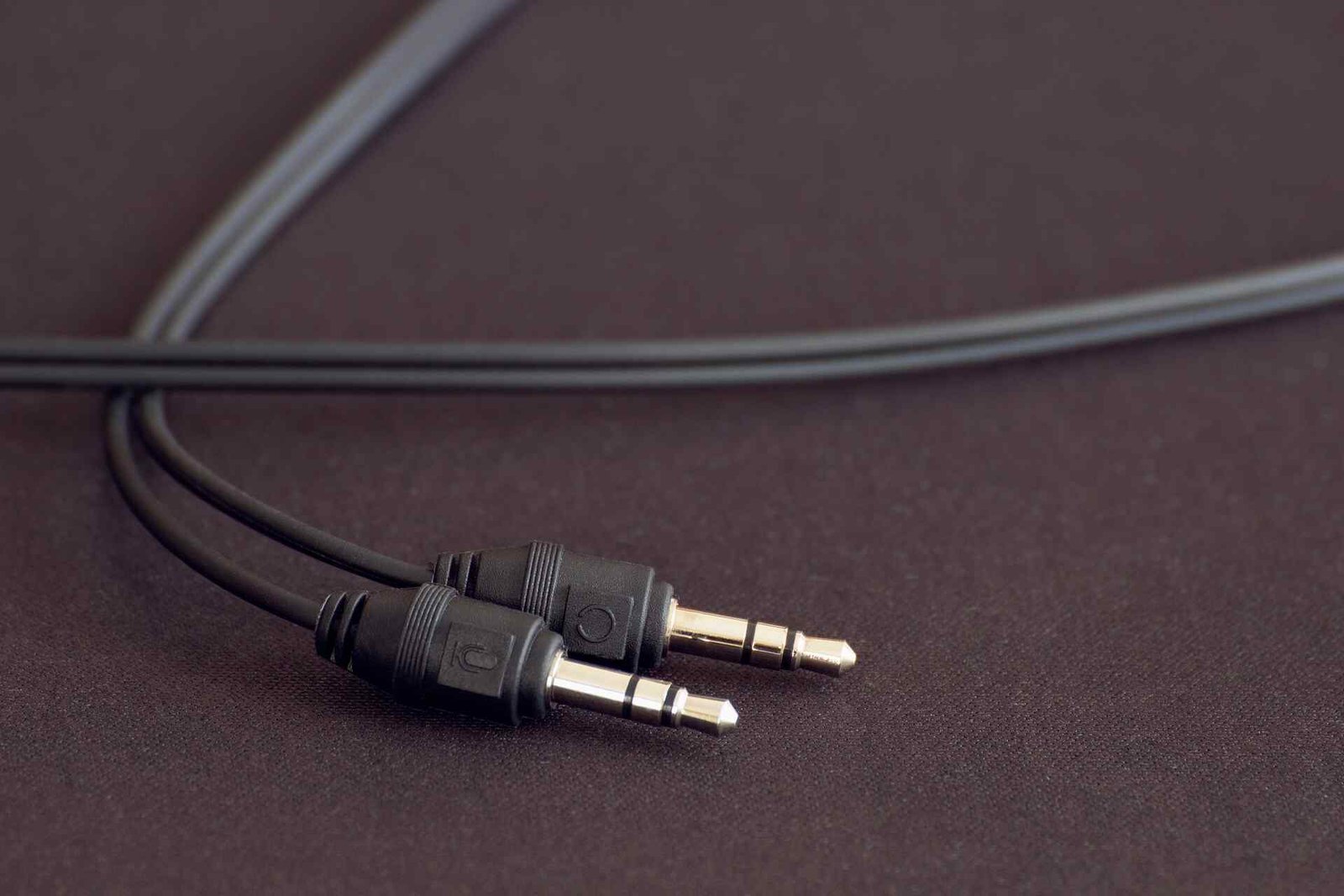 Two headphone plugs needing a splitter.