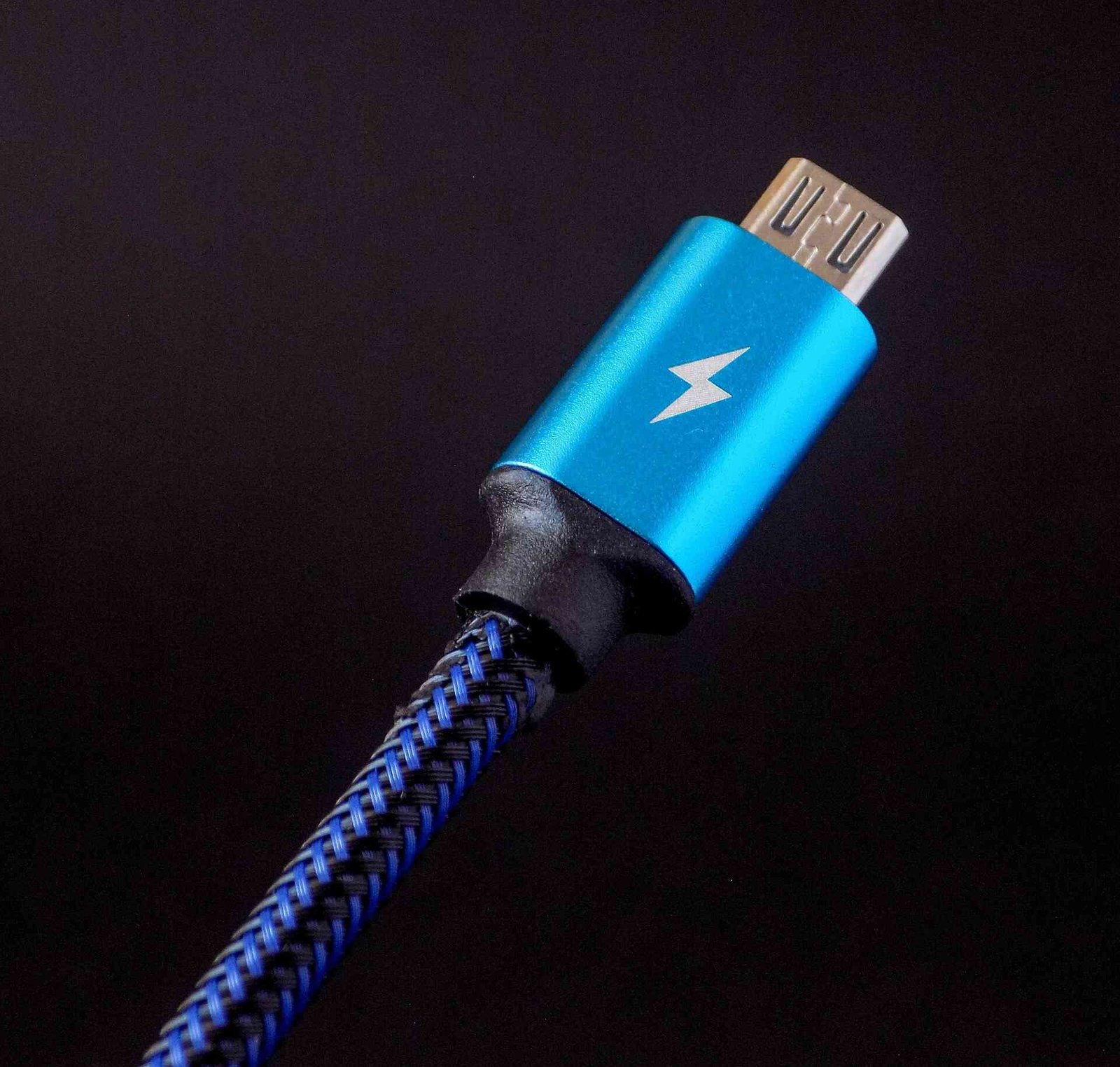 A blue thunderbolt USB cable.
