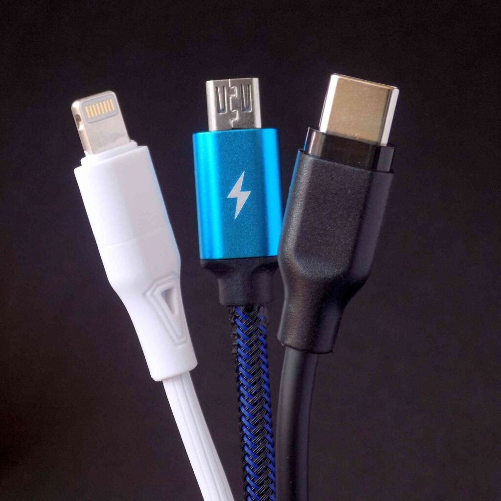 Three USB C cables with one thunderbolt cable in the middle.