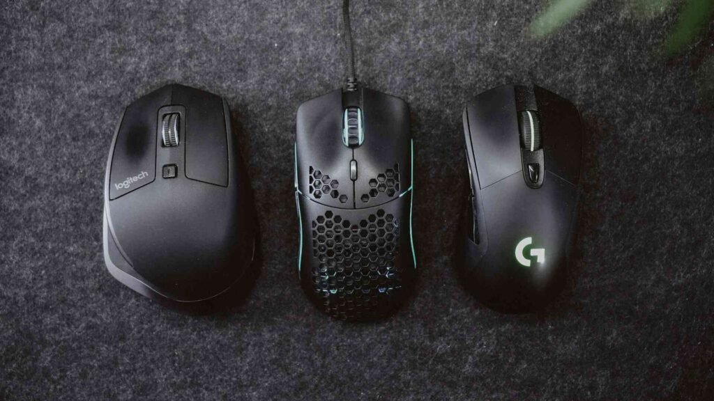 A collection of 3 black mice including 2 wireless ones.