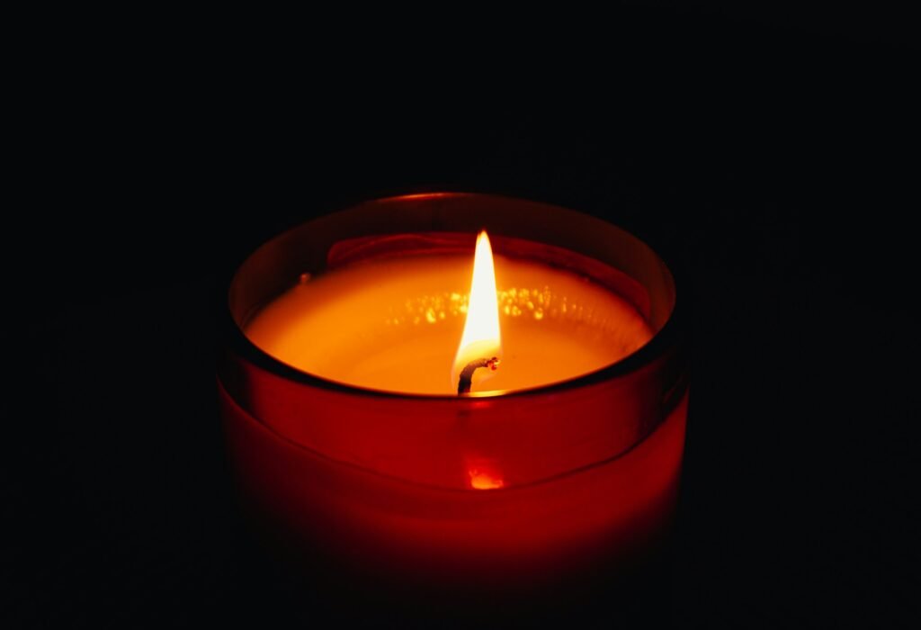 A candle picturing warm light.