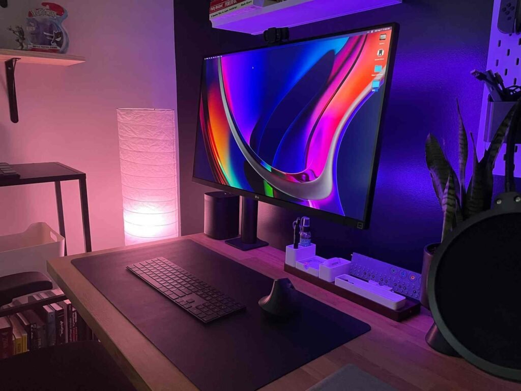 A workspace with warm pink lighting.