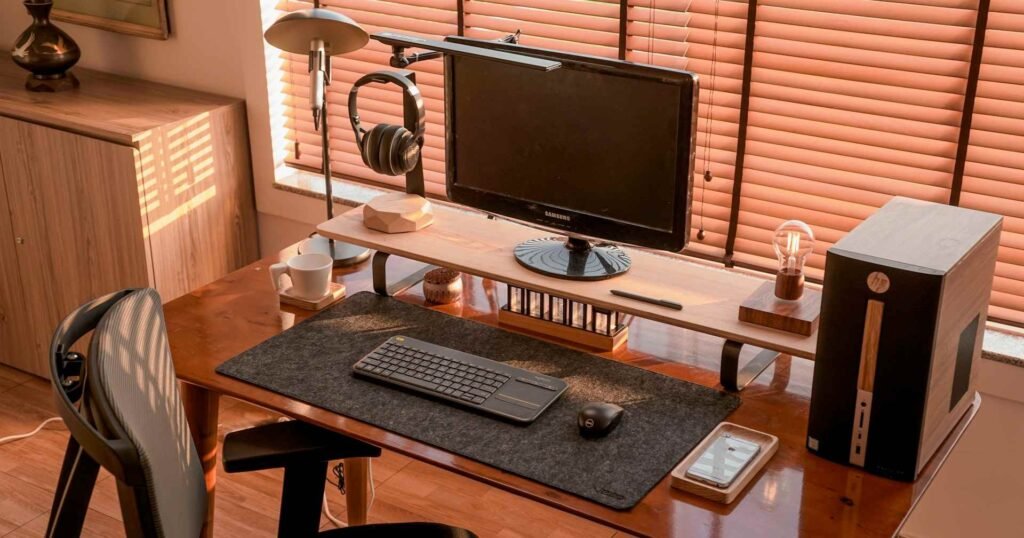 A full height adjustable desk setup with 2 desk layers and a chair.