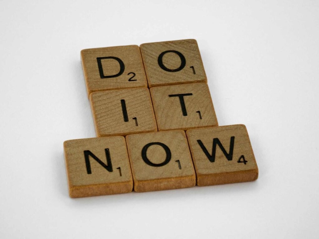 Multiple brown scribble pieces spelling out do it now.