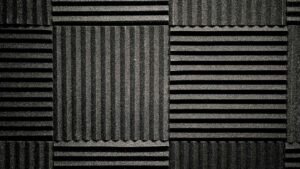 Black foam noise reduction panels covering a wall.
