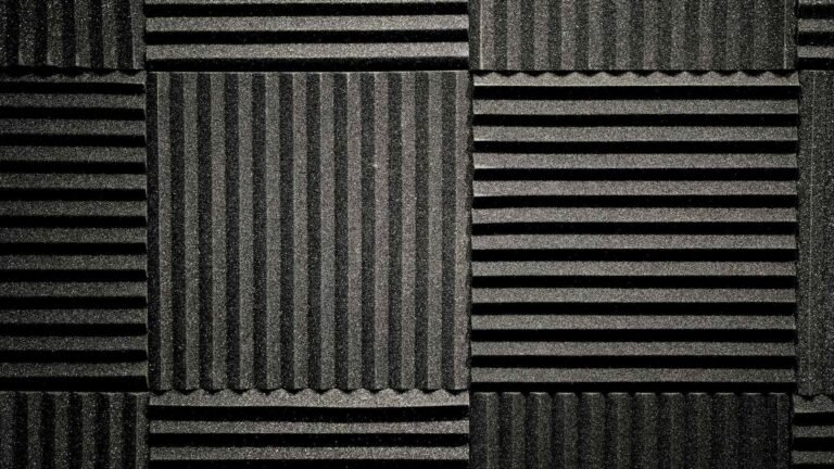 Black foam noise reduction panels covering a wall.