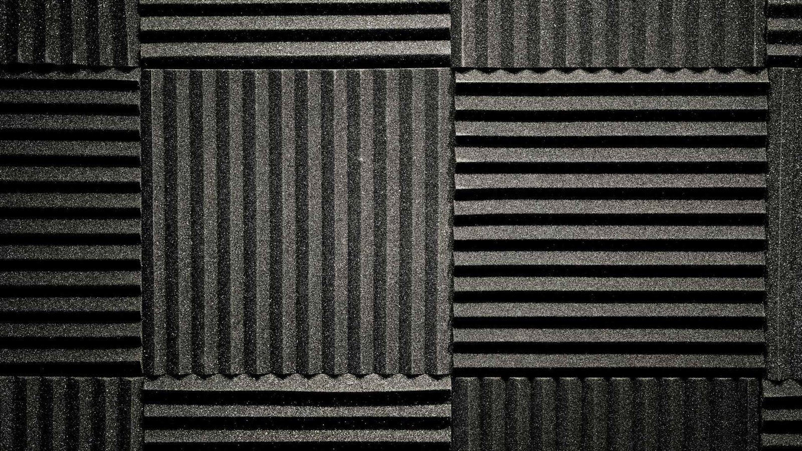 Black foam noise reduction panels covering a wall.