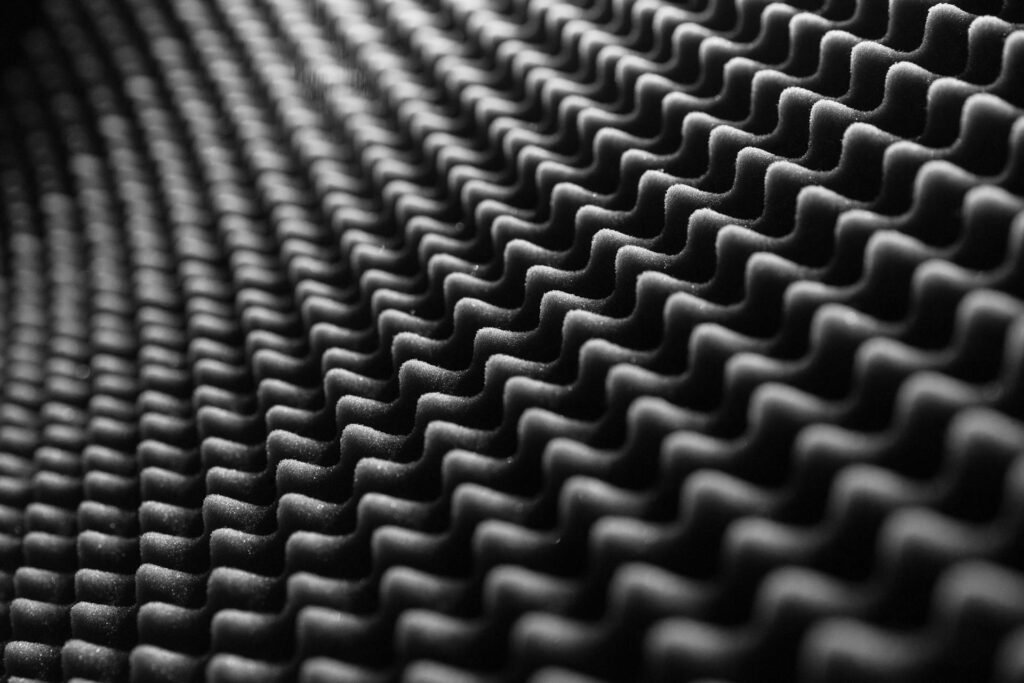 A close up of black sound proof foam.